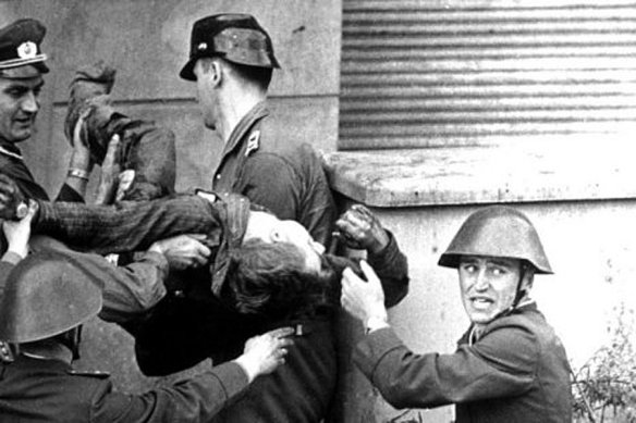 East German Border Guards carry the body of Peter Fechter - Victim of the Berlin Wall