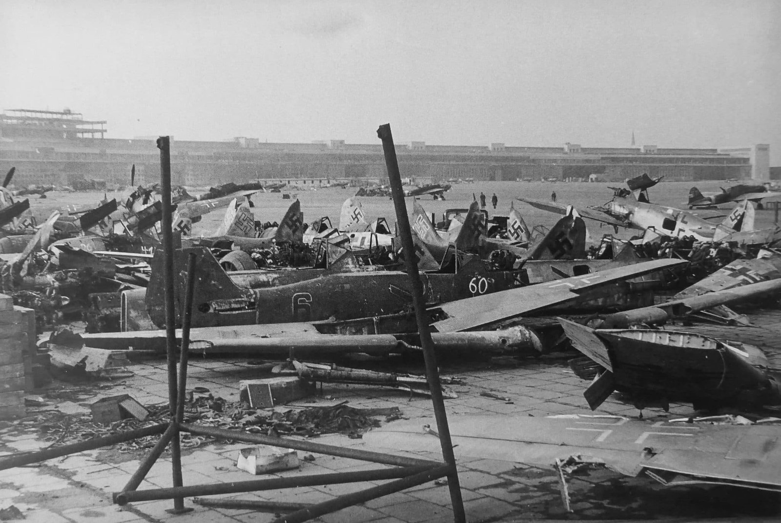 In the foreground are the Fokke-Wulf Fw.190 fighters. In the background are the Soviet IL-2 attack aircraft