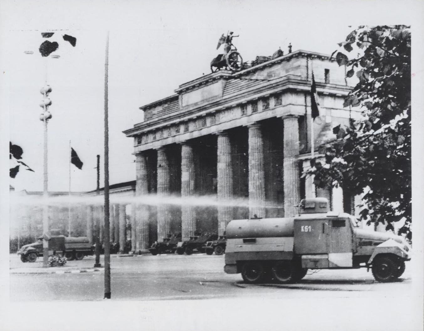 East German Army trucks spray high-pressure water at West Berliners protesting the division of the city/Image: CIA