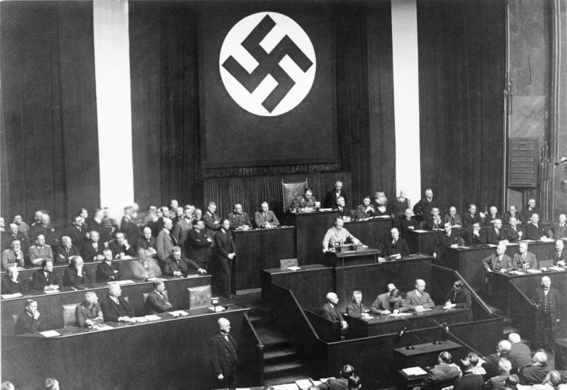 Hitler speaking during the Reichstag session to pass the Enabling Act, inside the Kroll Opera House (1933) - Bundesarchiv