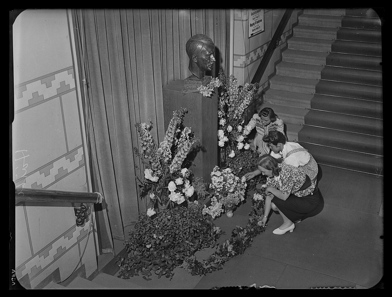 Flowers laid at the bust of Adolf Hitler in the Storting building, Oslo, Norway, July 21st 1944 - Public Domain