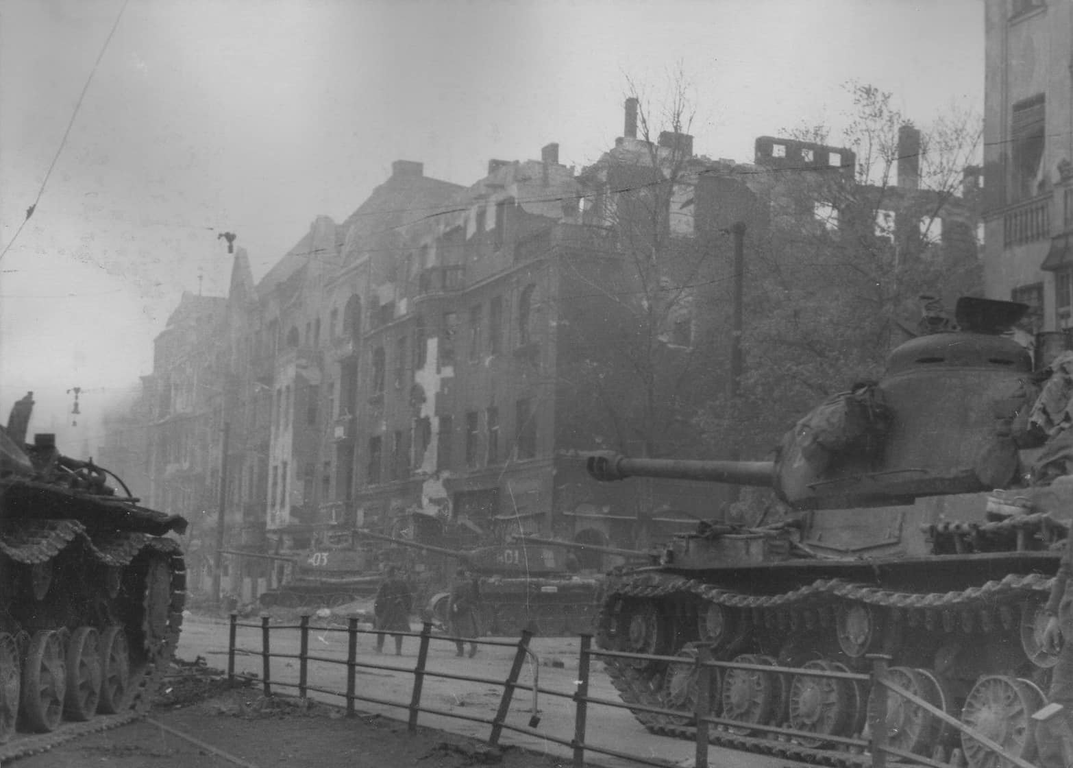 Column of the division of the Soviet heavy tanks IS-2 on the streets of Berlin