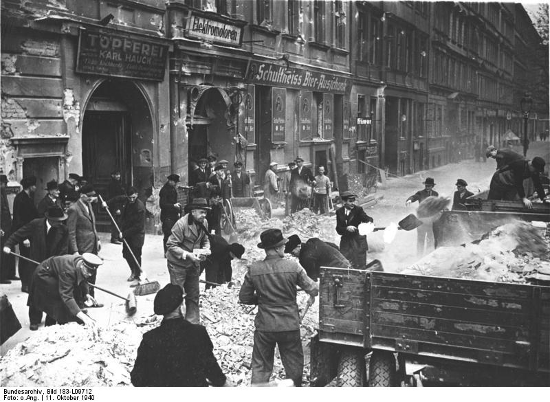 Berliners clearing the streets of rubble following an Allied air attack