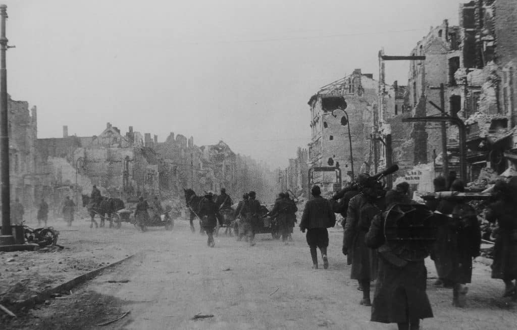 A column of Soviet artillerymen on the march along the Frankfurter Allee in Berlin