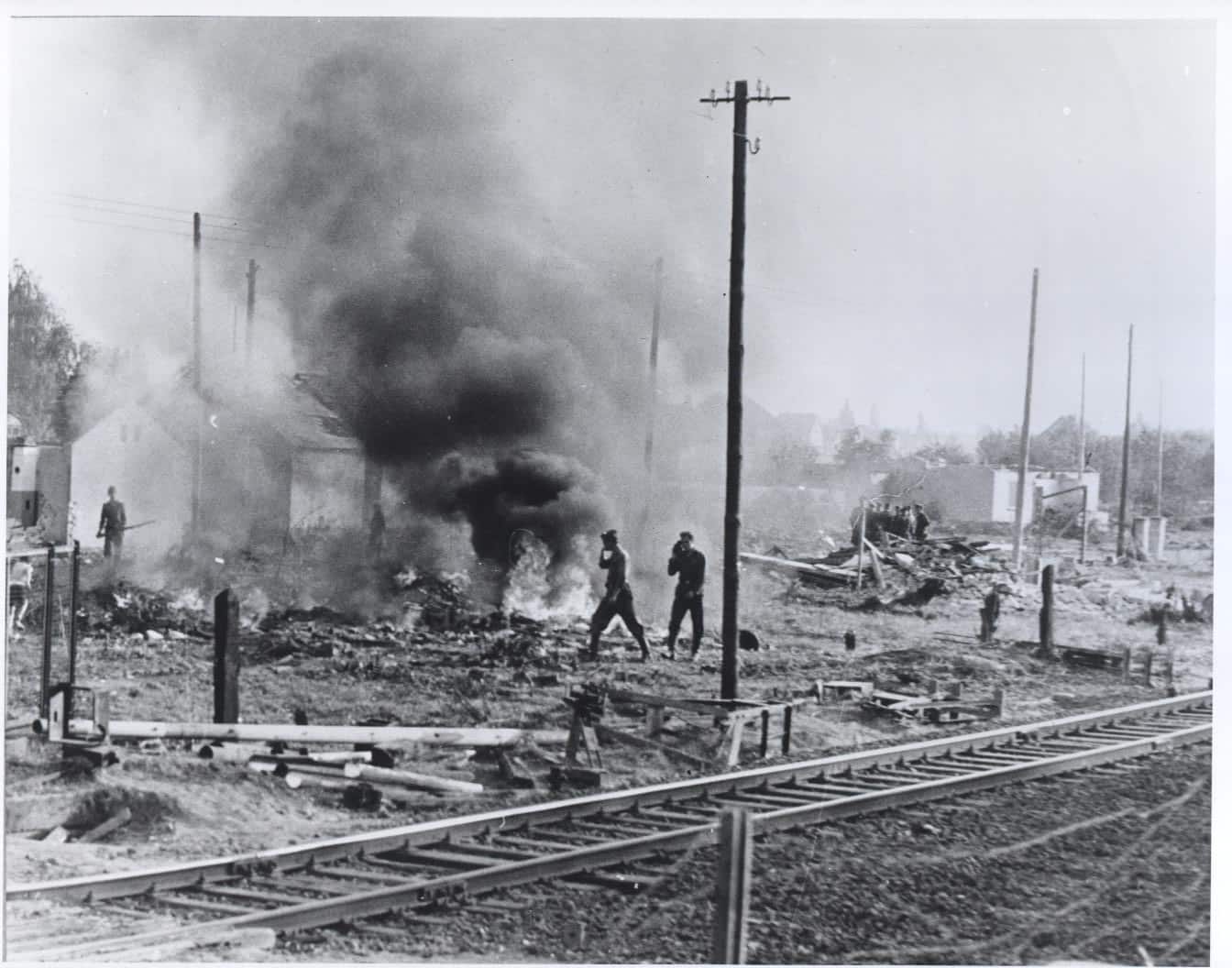 East Germans continue to clear the land flanking the eastern side of the border, burning what’s left of the houses that were razed to provide a clear line of fire at anyone seeking to cross into West Berlin. October 1961. From the CIA booklet "A City Torn Apart: Building of the Berlin Wall."