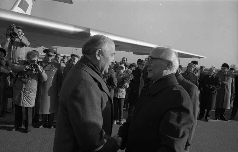 Soviet leader Mikhail Gorbachev greeting East German leader and 'architect of the Berlin Wall' Erich Honecker