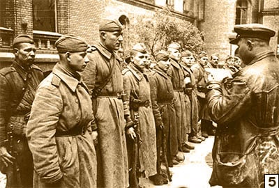 Red Army soldiers gather for an announcement on May 1st 1945/Public Domain