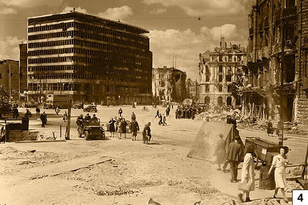 Potsdamer Platz, Berlin, 1945. On the left the Columbushaus, on the right the ruin of Hotel Fürstenhof. Canadian soldiers in the jeep/Public Domain