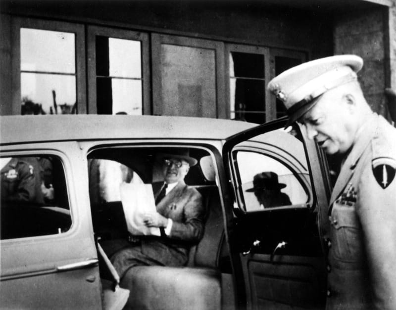 The Potsdam Conference - July 25th 1945 - Truman reading a newspaper with Eisenhower at the door of his car