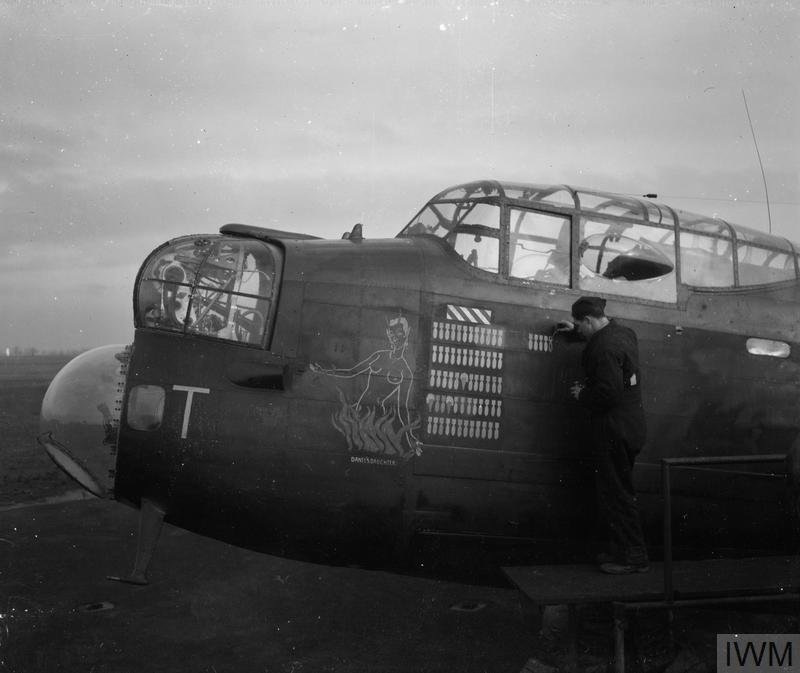 The nose of an RAF Avro Lancaster - "Dante's Daughter" - being painted folowing the aircraft's return from a raid on Berlin on the night of 15th/16th February 1944 - Public Domain