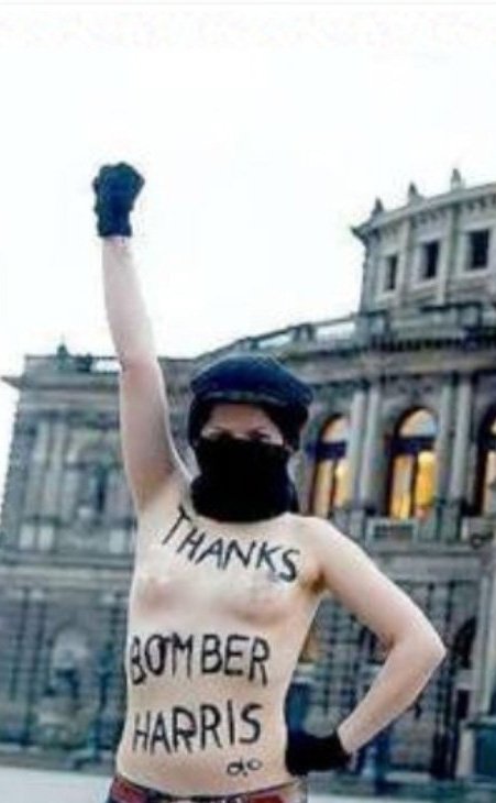 Die Linke politician for Berlin-Neukölln posing in Dresden with the slogan 'Thanks, Bomber Harris' (2023)