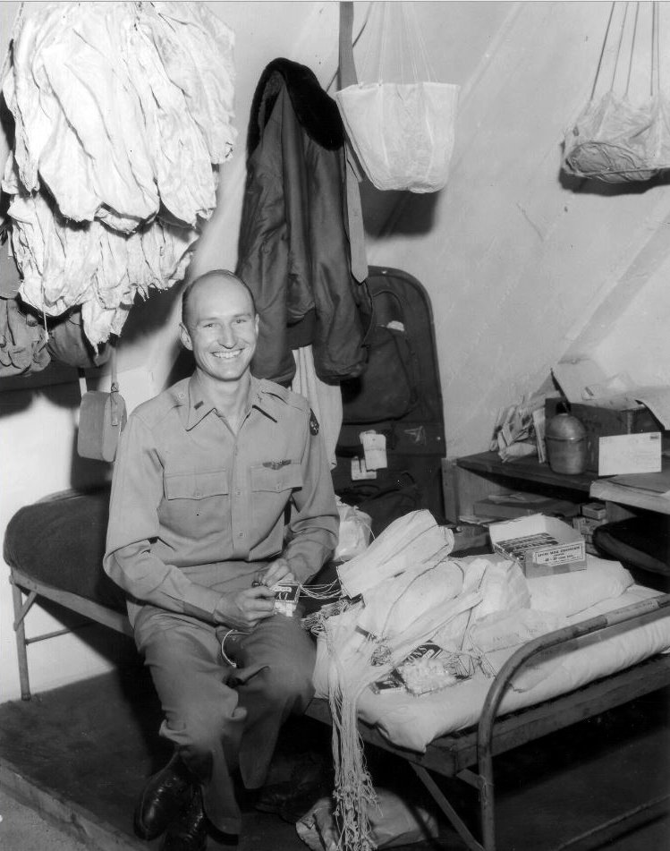 US Airman, Gail Hailvorsen, making mini parachutes for the sweets he would drop out of his plane on approach to Tempelhof Airport for children below - Public Domain