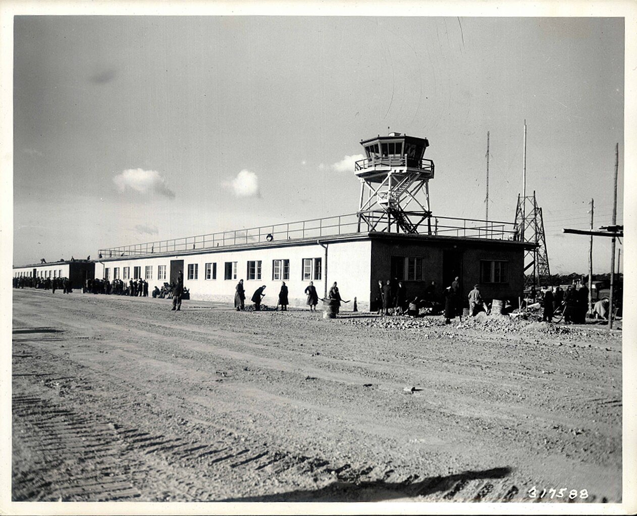 Civilians help with the construction of Tegel Airport in the French Sector of Berlin (1948) - Public Domain