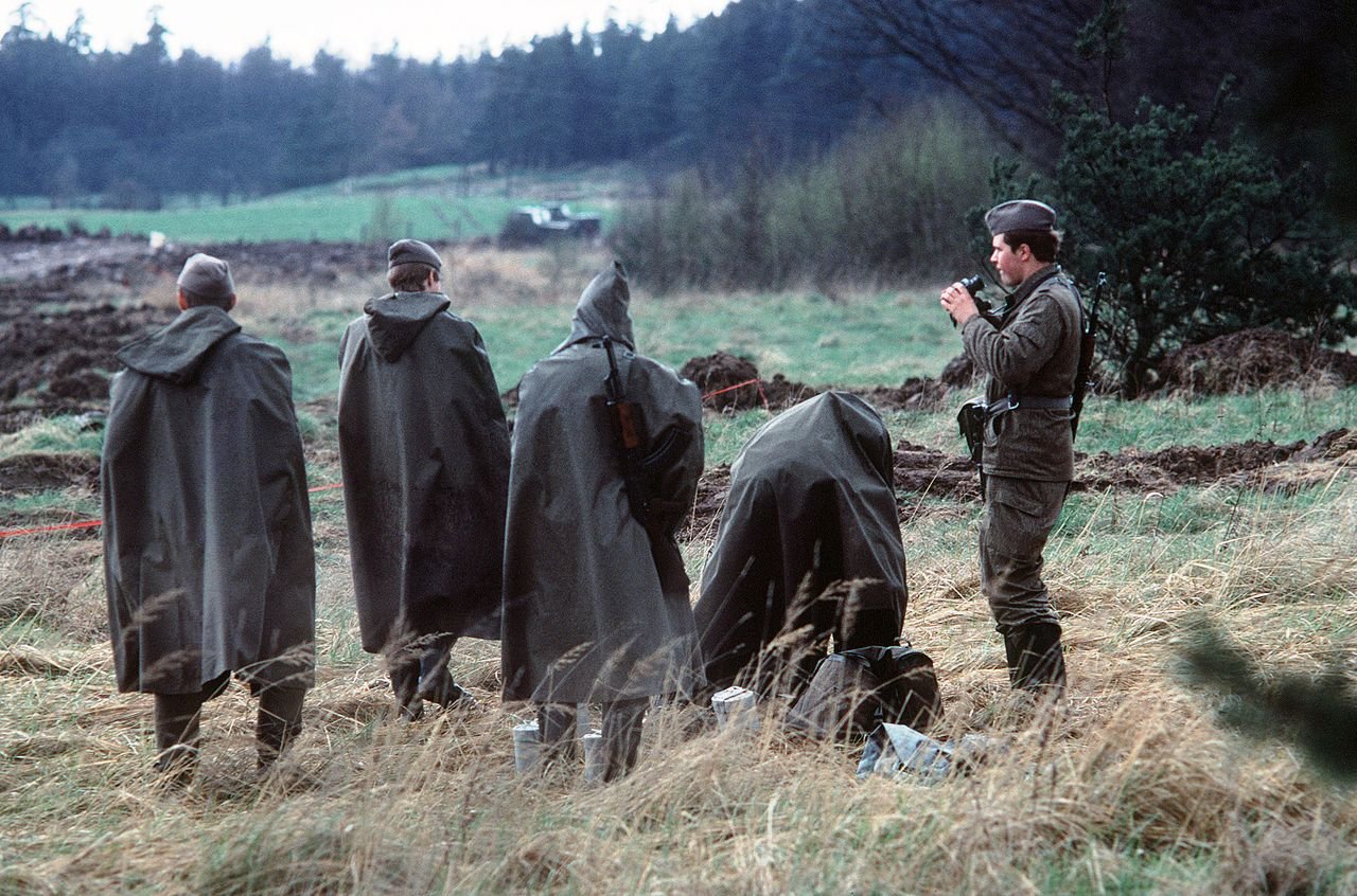 East German soldiers on guard at the border between East and West Germany (1979) - Public Domain