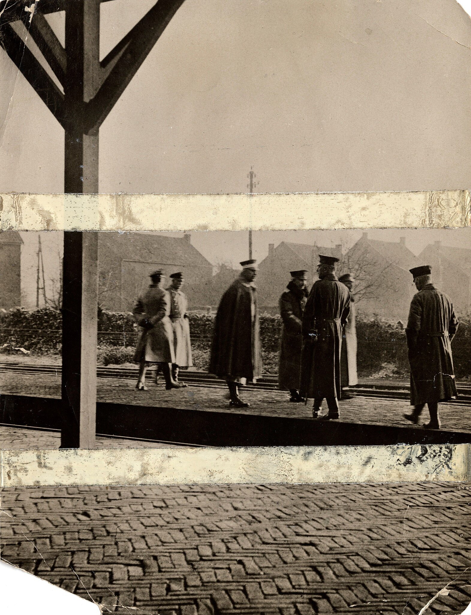 Early the morning after his abdication, former Emperor Wilhelm II of Germany stands with his entourage on the platform of Eijsden (Eysden) station in the Netherlands (1918) - Public Domain