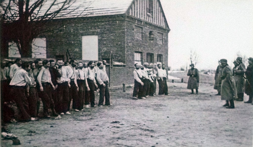 The arrest and humiliation of Polish Jews in 1939 by Einsatzgruppen men - Public Domain