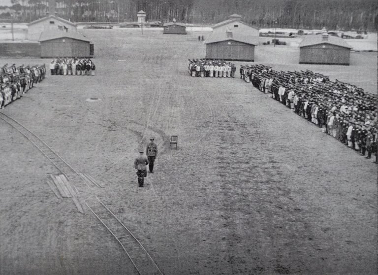 Prisoners at Sachsenhausen Concentration Camp attend roll call (1937) - Public Domain