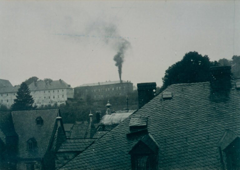 Photograph of the Hadamar killing centre with a smoking chimney, (1941) - Hadamar Memorial Museum