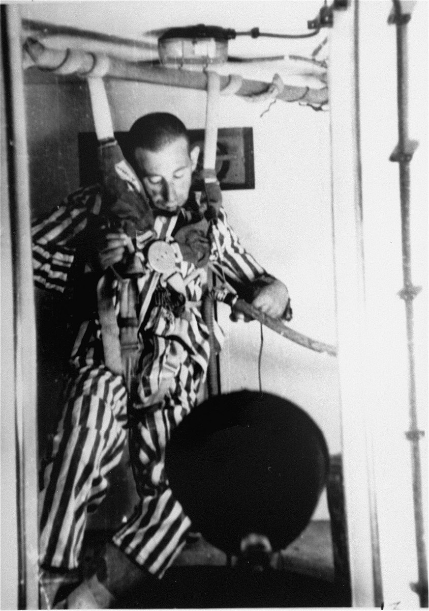 A victim loses consciousness during a depressurization experiment at Dachau by doctor Sigmund Rascher (1942) - Public Domain