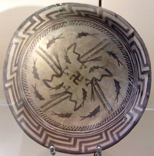 The Samarra bowl, from Iraq, circa 4,000 BCE, held at the Pergamonmuseum, Berlin. The swastika in the centre of the design is a reconstruction - Public Domain