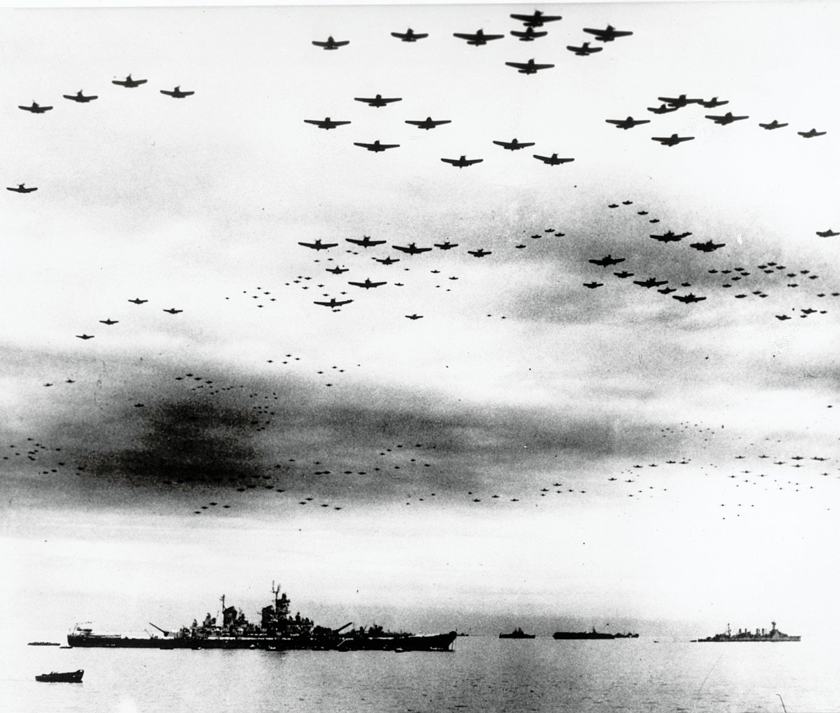 Carrier planes fly in formation over the U.S. and British fleets in Tokyo Bay during the Surrender of Japan (1945) - Public Domain