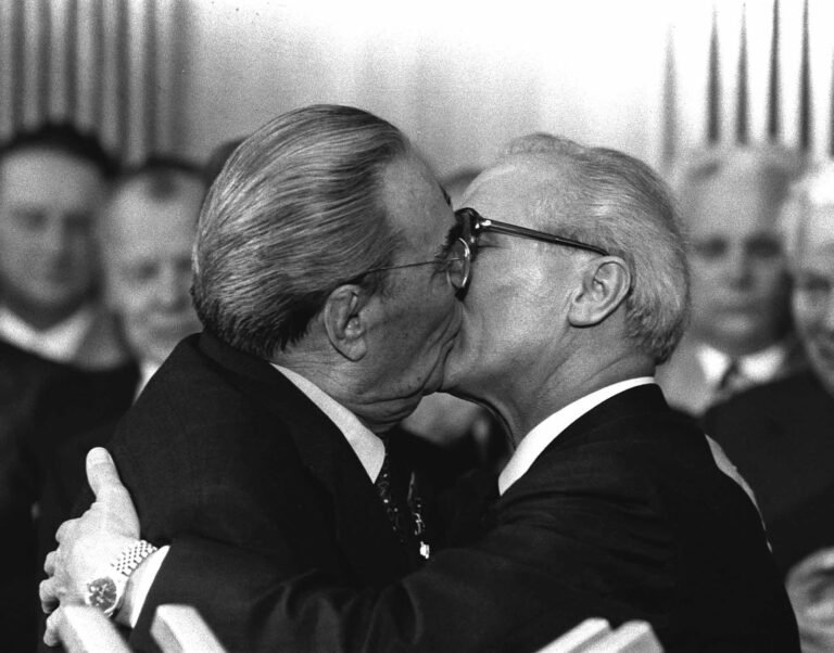 Leonid Brezhnev & Erich Honecker embrace in a Socialist Kiss in 1979 - Public Domain
