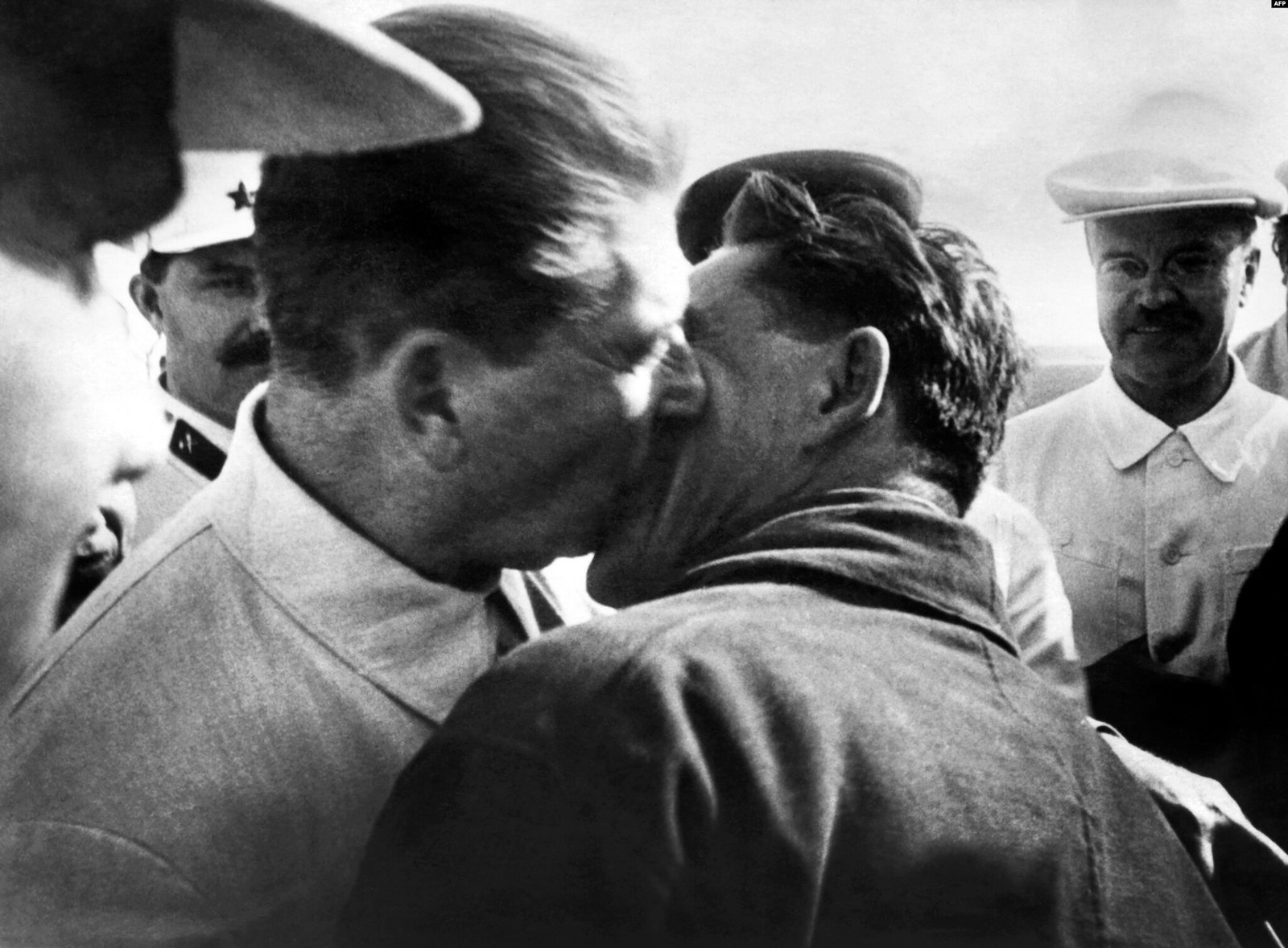 Soviet leader, Joseph Stalin, kissing pilot, Vasily Molokov - Public Domain