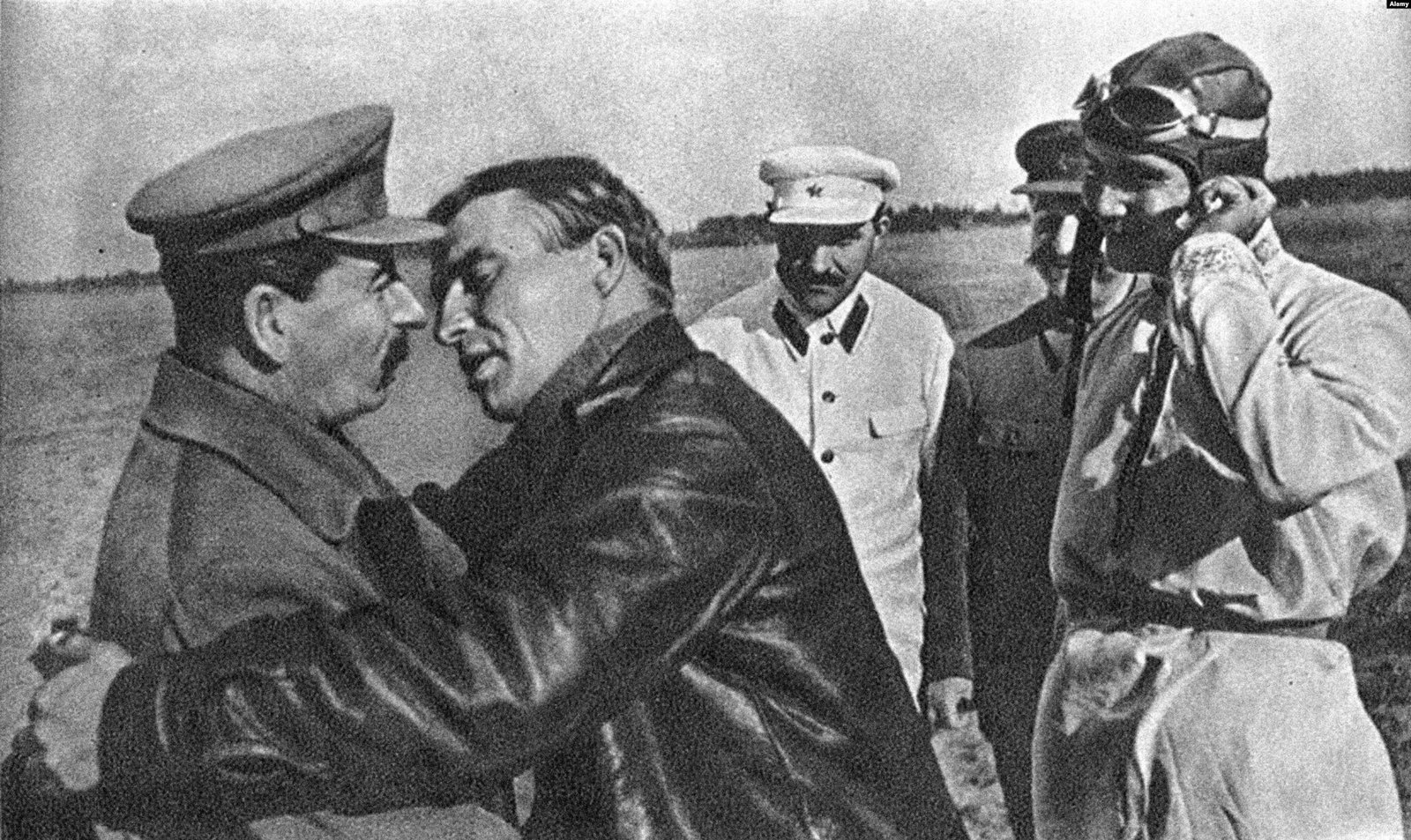 Soviet leader, Joseph Stalin, kissing pilot, Valery Chkalov - Public Domain